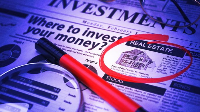 Newspaper with real estate investment circled