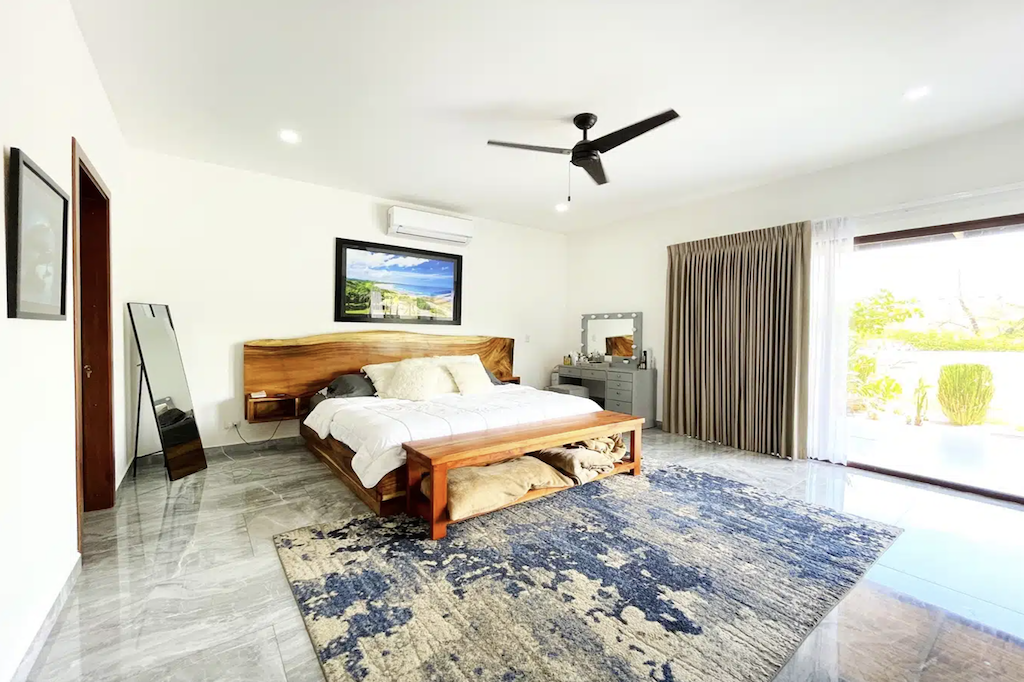 The home boasts two generously sized ensuite bedrooms, providing comfort and privacy for both residents and guests. The master suite features stunning ocean views, a reach-in closet with sliding doors, and a luxurious ensuite bathroom with double sinks, a soaking tub, and a separate shower. 